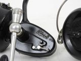 a close up of a fishing reel and a fishing reel