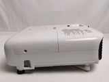 a white projector sitting on top of a white table