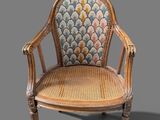 an image of a wooden chair with a blue and yellow upholstered seat