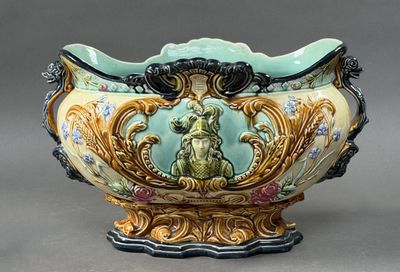 a large vase with a dog on it on a stand