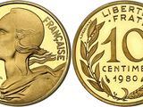 a gold coin with the face of a woman in profile