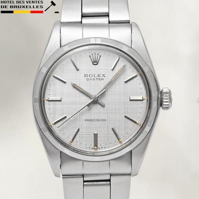 an image of a silver rolex watch with a white dial