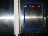 an image of a stainless steel refrigerator with a blue window