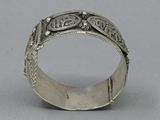 an image of a silver ring with a design on it