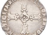 an image of a silver coin with a cross on it