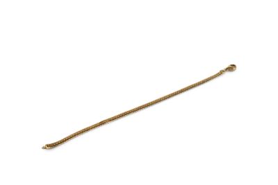 a close up of a gold chain on a white background