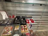 a glass display case with various items on it