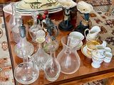 a table that has a lot of glass items on it