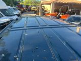 many cars parked in a parking lot next to each other
