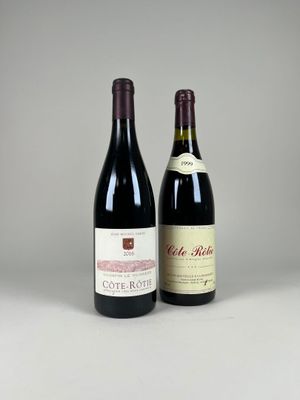 two bottles of wine sitting next to each other on a table