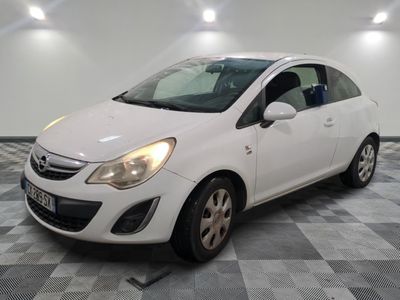 a picture of a small white car parked in a garage