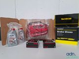 a box of brake shoes and a bottle of cleaner on a table