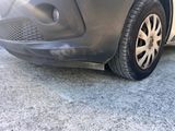 a close up of a car ' s tire on the road