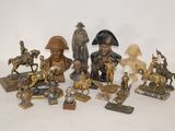 a lot of figurines that are sitting on a table