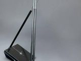 two blue lamps on a metal stand next to a laptop