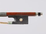 a bow that is attached to a bow with a wooden handle
