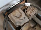 an old engine sitting on a cart in the garage