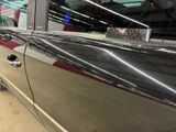 an image of a car door handle with a sticker on it
