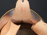 a close up of a helmet with a bell on it