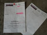 two papers sitting on top of a table next to each other