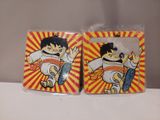 two small plastic plates with cartoon characters on them