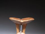 an image of a small wooden bowl sitting on top of a table