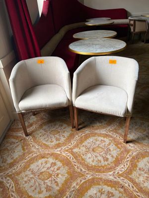 two chairs and a table in the corner of a room