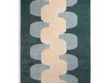 a green rug with circles and circles on it