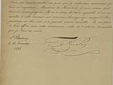 un vieux document sur lequel figurent une lettre manuscrite et l'image d'un oiseau