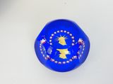 an image of a blue glass bowl with stars and a statue of liberty on it