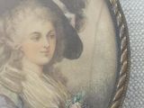 painting of a lady in a blue dress and hat holding a flower