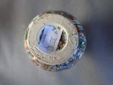 an overhead view of a vase with a tag on it