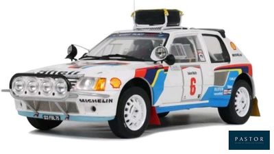 a model of a rally car on display on a white background