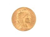 an image of a gold coin on a white surface