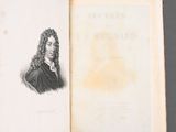an old book with a drawing of a man with long hair