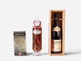 a bottle of liquor next to a box of chocolates