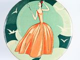 a plate with a picture of a woman holding a tennis racquet