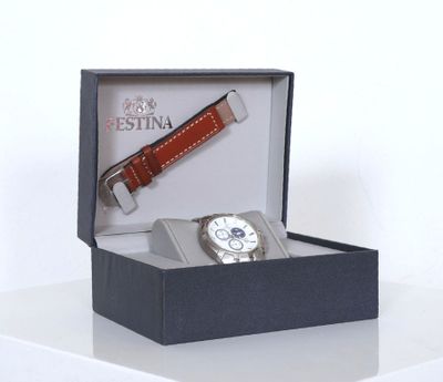 a watch and a watch band in a box on a table