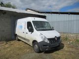 a white van that is parked in front of a building