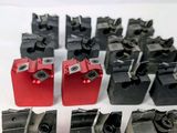 a lot of red and black tools on a white surface