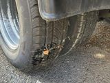 a close up of a tire on the road