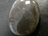 a close up of a stone on a table with a black background