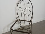 a metal chair that is sitting in a room