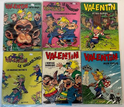 several children ' s comics are lined up on a table
