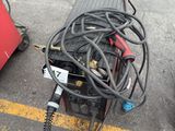 a lot of wires and other equipment on the ground