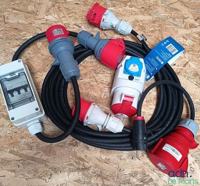 a bunch of electrical cords and plugs on the floor