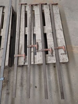 several pieces of wood sit on top of a concrete floor