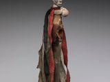 an image of a statue of a man with a hat and robe