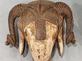 a carved animal head on the wall of a room