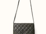 a black chanel bag on a white background